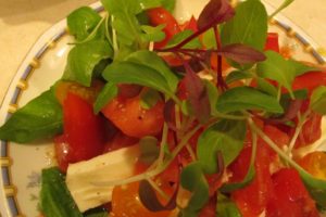 microgreens on tomato salad