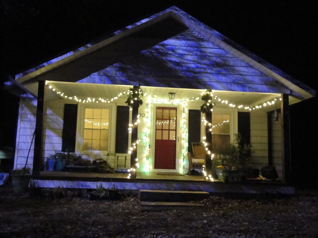 new house with Christmas lights, new gardens will be planted