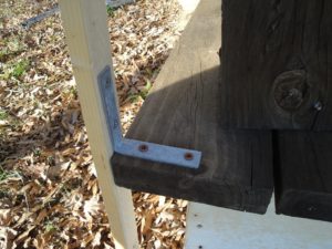 corner brace screwed to decking and post