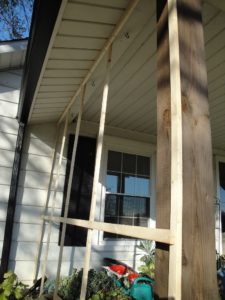 enclosing the porch, west side wood supports